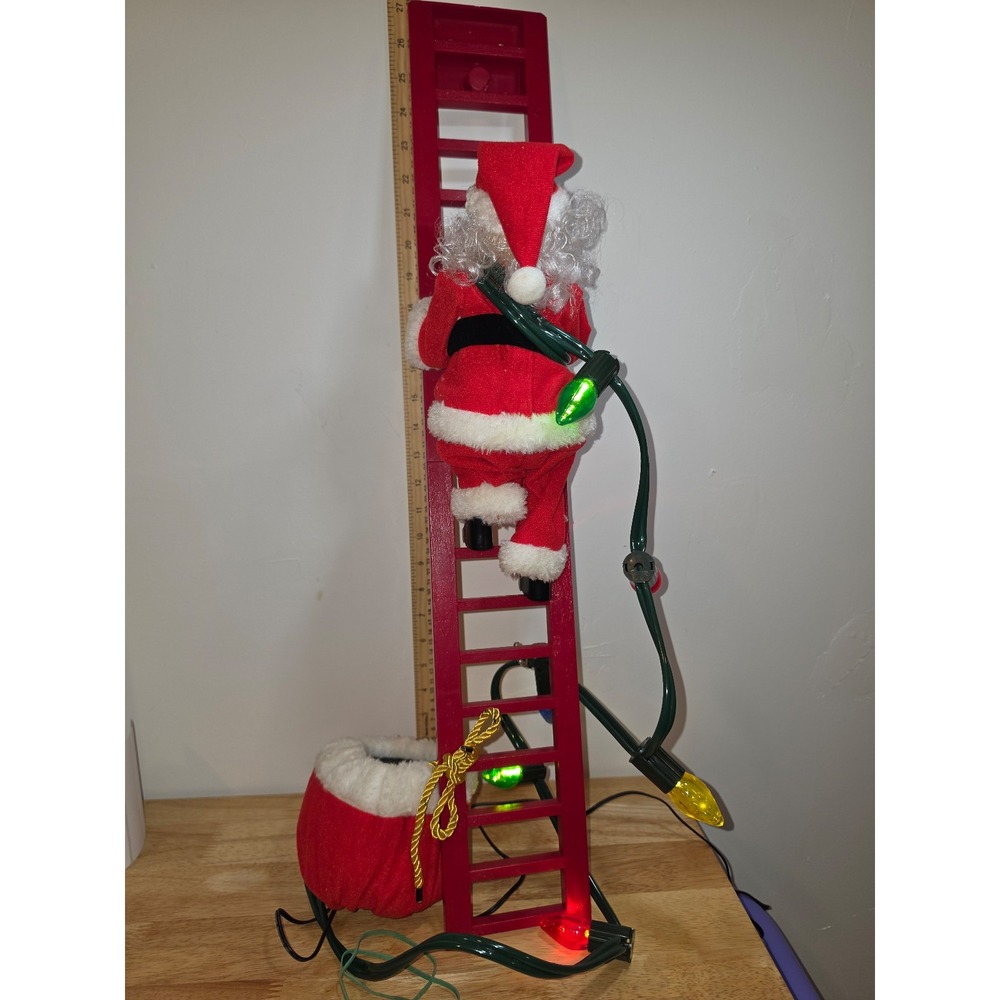 Santa Claus climbing ladder with lights Christmas decor